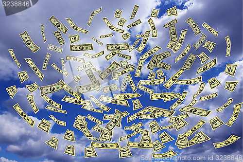Image of dollars flying away to the sky