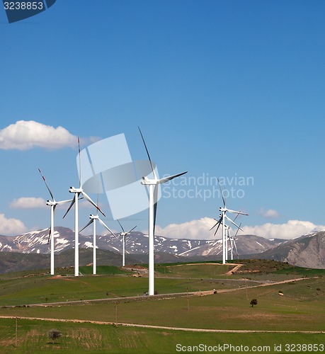 Image of Wind farm at sun spring day