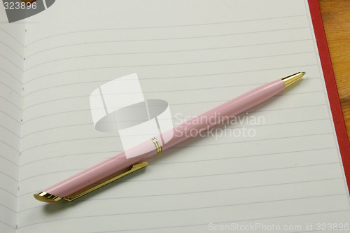 Image of pen on a notebook