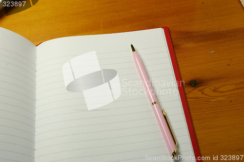 Image of pen on a notebook