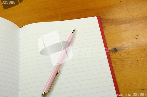 Image of pen on a notebook