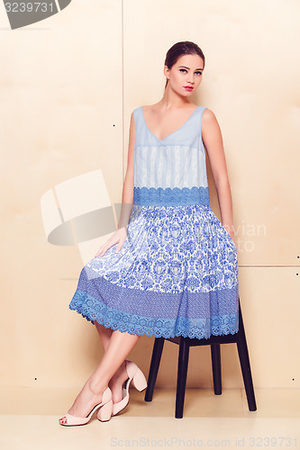 Image of Full body slim woman in blue sundress