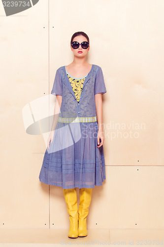 Image of Full body slim woman in blue sundress