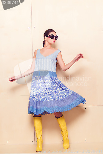 Image of Full body slim woman in blue sundress