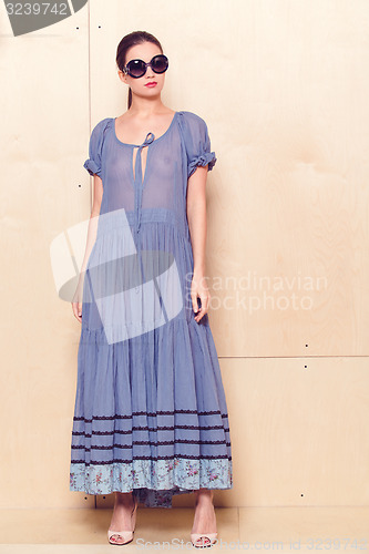 Image of Full body slim woman in blue sundress