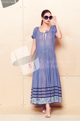 Image of Full body slim woman in blue sundress