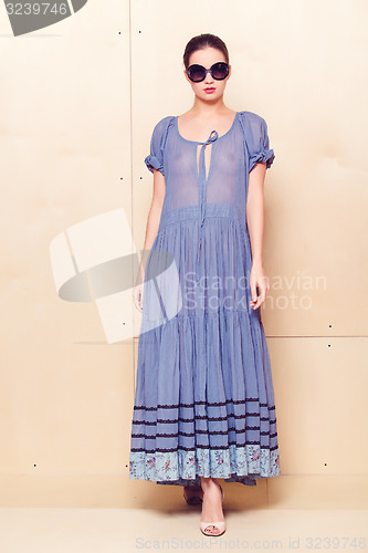 Image of Full body slim woman in blue sundress