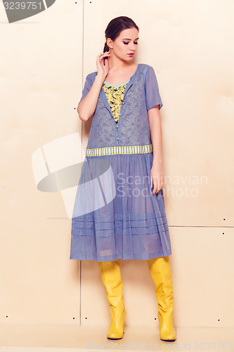 Image of Full body slim woman in blue sundress