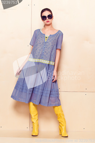 Image of Full body slim woman in blue sundress