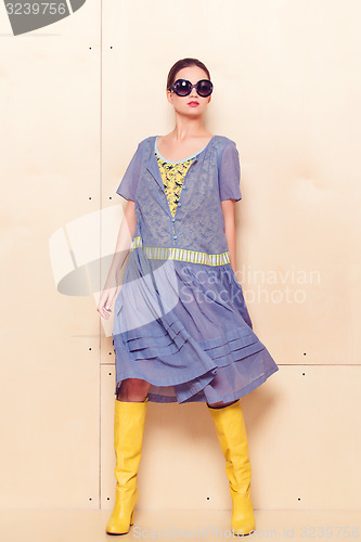 Image of Full body slim woman in blue sundress
