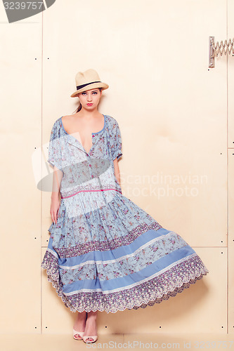 Image of Full body slim woman in blue sundress