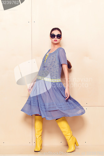 Image of Full body slim woman in blue sundress
