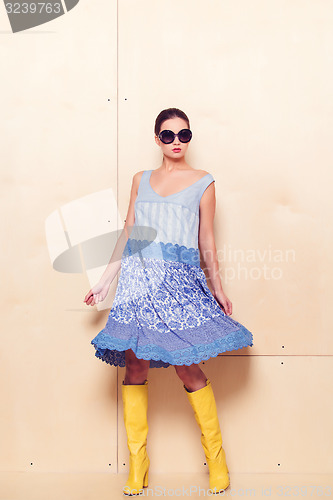 Image of Full body slim woman in blue sundress