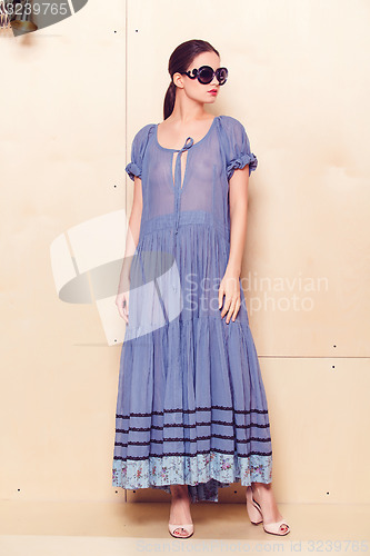 Image of Full body slim woman in blue sundress