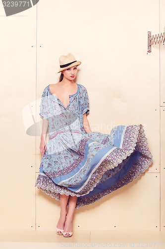 Image of Full body slim woman in blue sundress