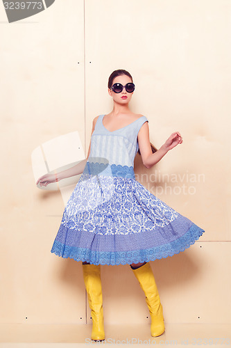 Image of Full body slim woman in blue sundress