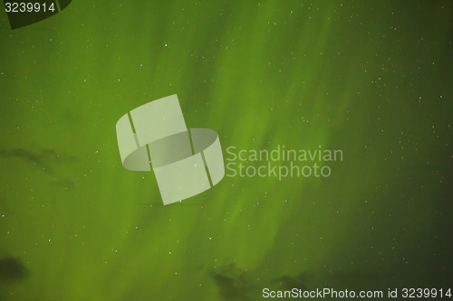 Image of Northern lights with bright stars in Iceland