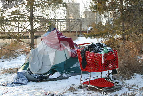 Image of homeless person's tent and shopping cart