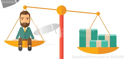 Image of Businessman on a balance scale