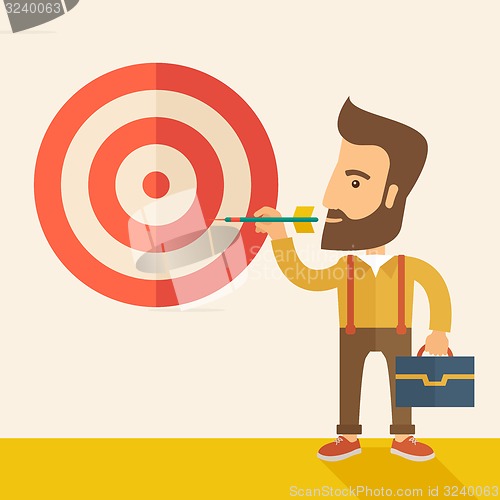 Image of Working man holding a target arrow 