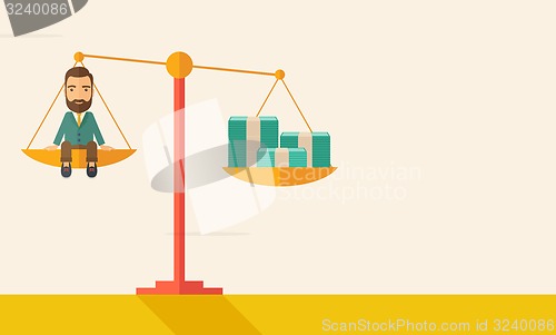 Image of Businessman on a balance scale