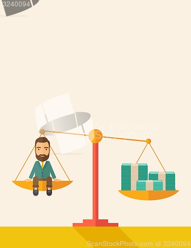 Image of Businessman on a balance scale
