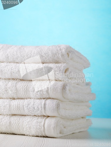 Image of stack of white spa towels