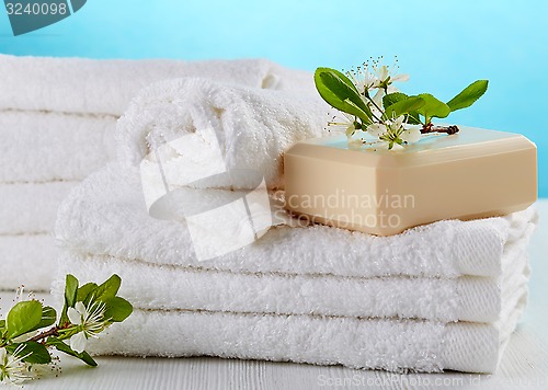 Image of stack of white spa towels