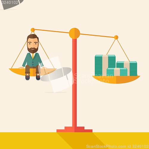 Image of Businessman on a balance scale