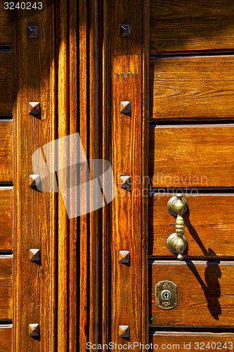 Image of abstract  rusty brass brown knocker olgiate olona varese italy