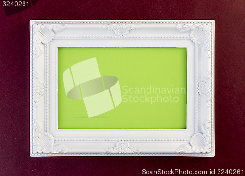 Image of White Frame on dark red 