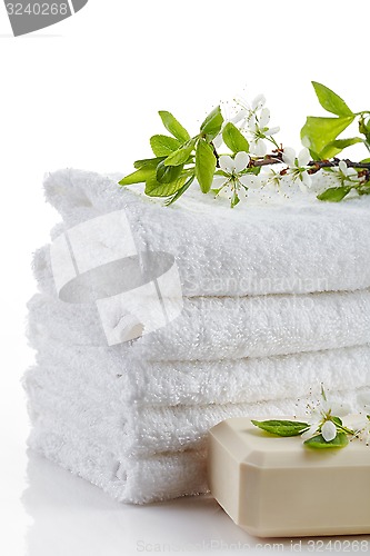 Image of stack of white spa towels