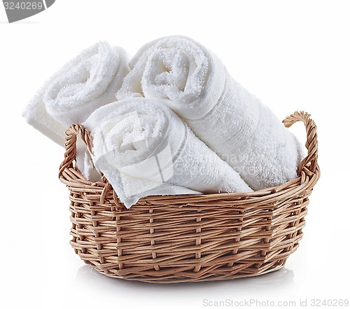 Image of white spa towels in a basket