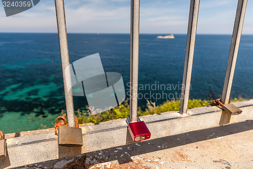 Image of Metal padlock - memory locks on the bridge, symbol of love