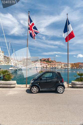 Image of small car on the waterfront of Porto Azzurro, Italy