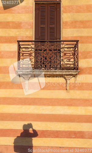 Image of door with balcony in venetian style on Verona street