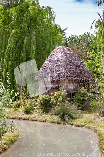 Image of Small hut with a thatched roof.