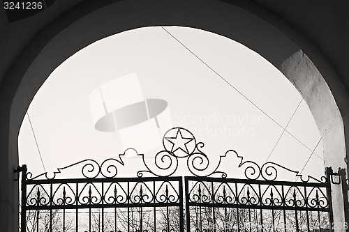 Image of Arch with old wrought iron gates