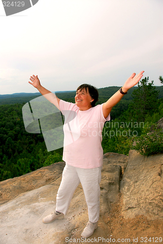 Image of Mature woman cliff