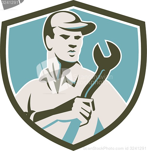 Image of Mechanic Holding Spanner Front Shield Retro