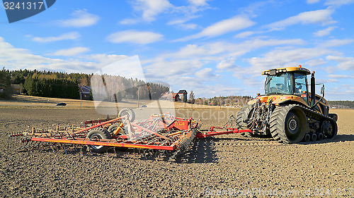 Image of Challenger MT765C Tracked Tractor and Cultivator on Field