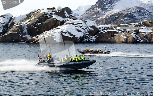 Image of RIB boats racing in and out of Svolvaer harbour