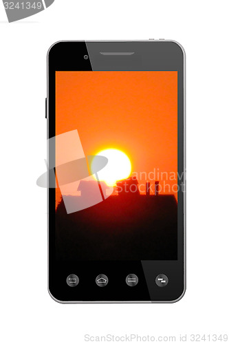 Image of Modern smart-phone with picture of sunset on white