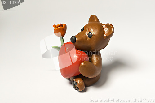 Image of Plasticine bear with flower and eight