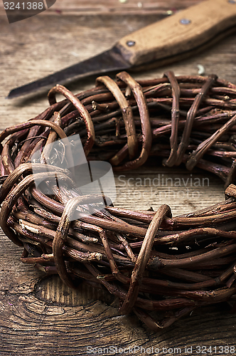 Image of licorice rolled in coil on wooden background