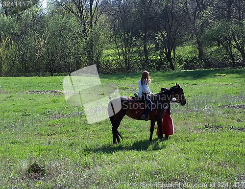 Image of Girl sitting on a horse