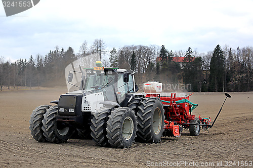 Image of Valmet 8550 Tractor and Seeder on Field at Spring