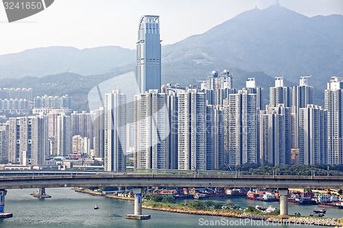 Image of high speed train on bridge in hong kong downtown city