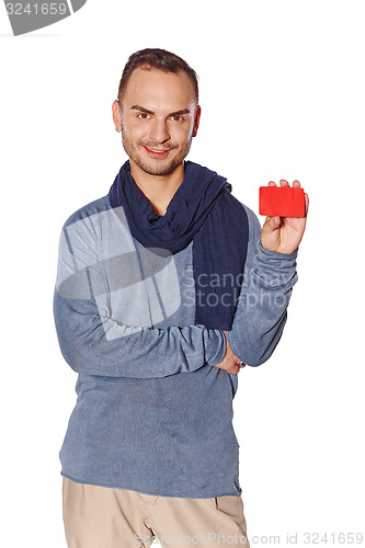 Image of Smiling casual man showing blank credit card