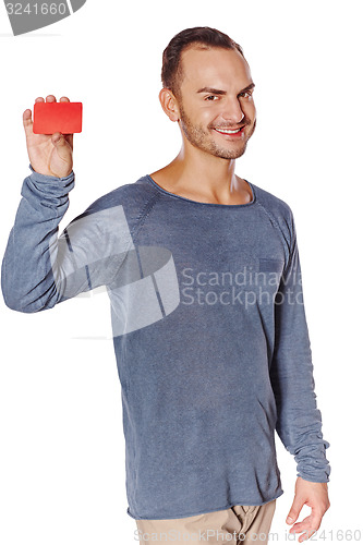 Image of Smiling casual man showing blank credit card